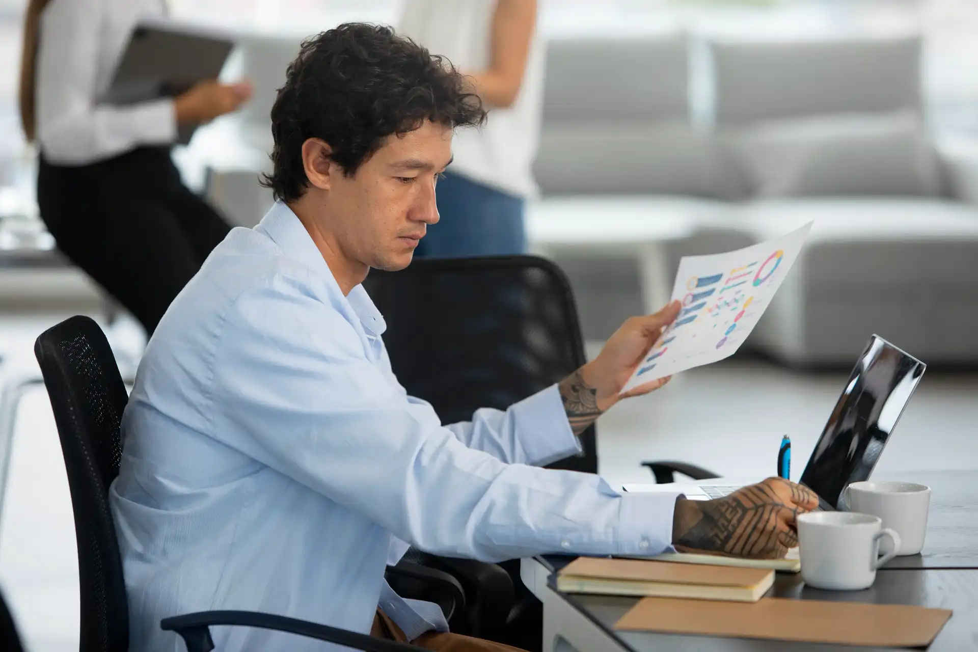 Detailed survey draft and notes on a desk showing the early stages of questionnaire development for research.