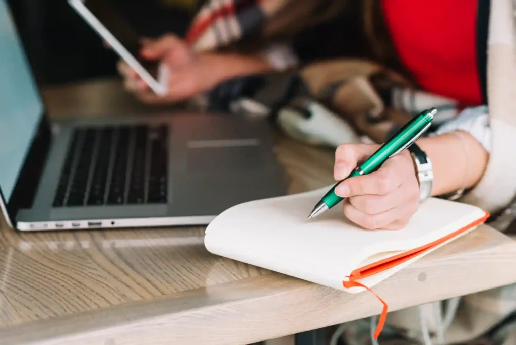 Phd thesis writing process showing doctoral student working on research proposal and thesis writing